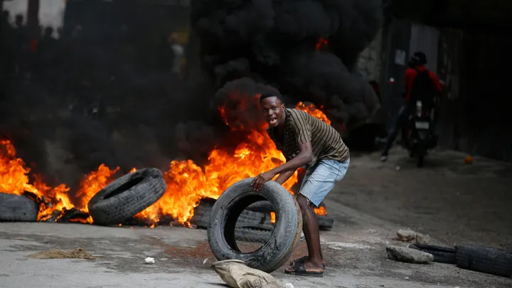 Haitian PM Henry urges calm as protesters, rioters insist that he resigns