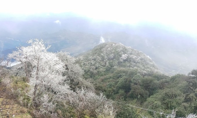 White frost covers Vietnam's northern mountain peak