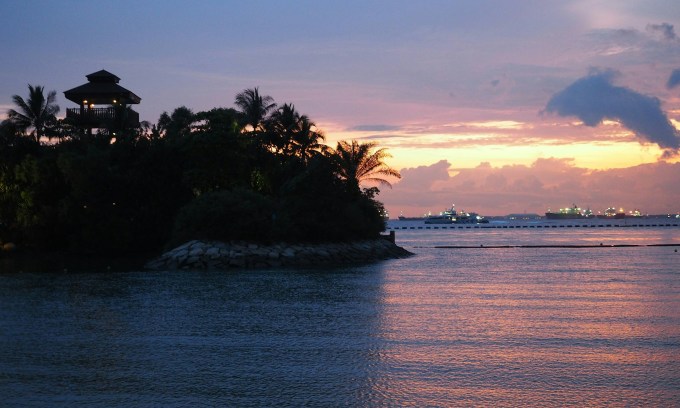 Singapore says dredger that hit tanker reported sudden loss of control, Sentosa oil spill cleanup ongoing